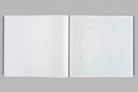 An Acrylic Glass Pyramid and Three Pendulums attached to a Triangle on a Table